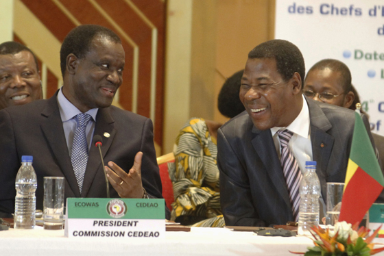 President of the Committee of ECOWAS Kadre Desire Ouedraogo (L) speaks with Benin's President Thomas Boni Yayi (R) during the 44th Ordinary Summit of heads of state and governments of the Economic Community Of West African States (ECOWAS) at Felix Houphouet Boigni Fondation in Yamoussoukro March 29, 2014. REUTERS/Thierry Gouegnon