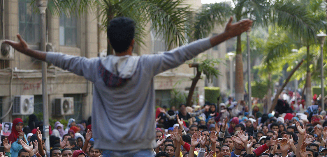 Cairo University students shout slogans against the government after the verdict of former Egyptian President Hosni Mubarak's trial at the university's campus in Giza, on the outskirts of Cairo November 30, 2014. Protests erupted at universities across Egypt on Sunday, condemning a court decision to drop criminal charges against Mubarak, the president whose ouster in the 2011 uprising raised hopes of a new era of political openness. REUTERS/Amr Abdallah Dalsh 