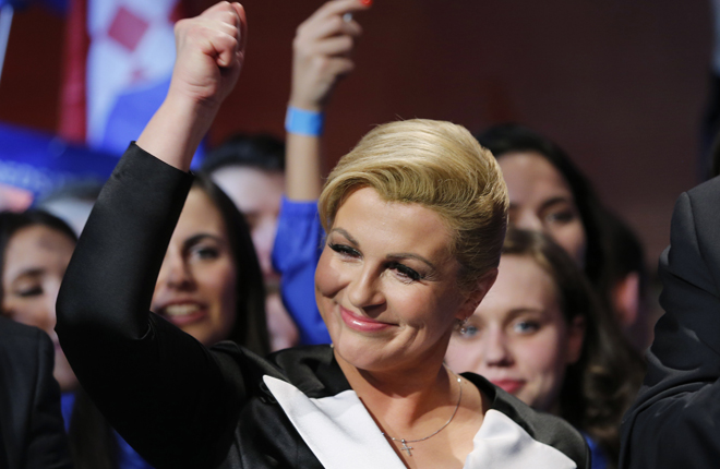 Zagreb, Croatia Kolinda Grabar-Kitarovic of the opposition HDZ celebrates her victory in Croatia's presidential run-off election on the stage at her campaign headquarters in Zagreb January 11, 2015. Croatia's conservative opposition won a narrow presidential victory on Sunday, capitalising on popular discontent over economic decline and setting down a marker for parliamentary elections later in the year. REUTERS/Antonio Bronic
