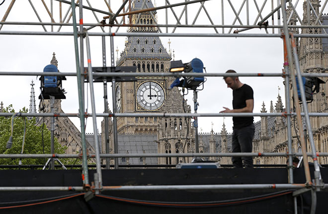 London, United KingdomA man works on a television platform being erected on College Green outside the Houses of Parliament in London May 5, 2015. Britain will go to the polls in a national election on May 7. REUTERS/Peter Nicholls