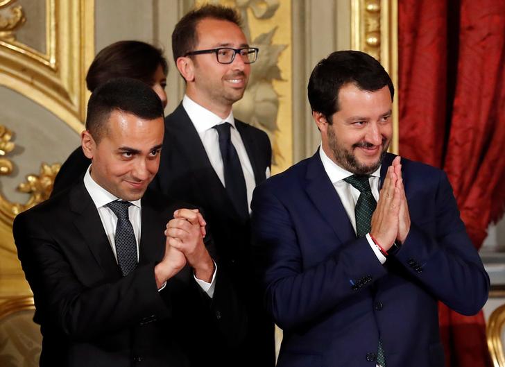 Italy's Minister of Labor and Industry Luigi Di Maio gestures next to Interior Minister Matteo Salvini after the sworn-in ceremony at the Quirinal palace in Rome, Italy, June 1, 2018. REUTERS/Remo Casilli