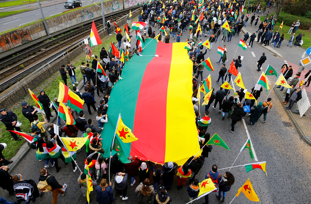 Kurdish protesters attend a demonstration against Turkey's military action in northeastern Syria, in Cologne, Germany, October 12, 2019. REUTERS/Thilo Schmuelgen