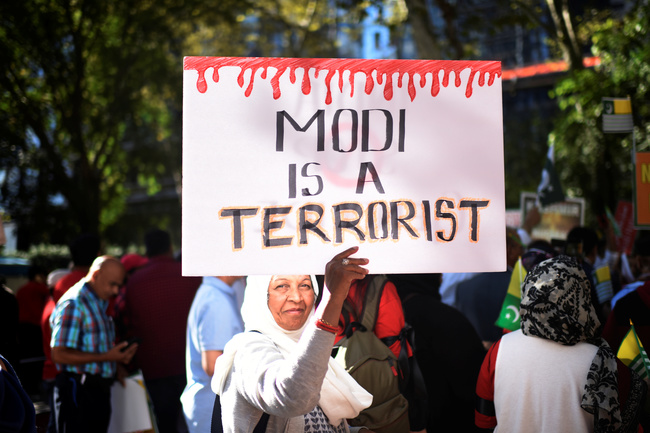A woman holds a placard while protesting in solidarity with the people of Kashmir on the sidelines of the United Nations General Assembly in New York, U.S., September 27, 2019. REUTERS/Mark Kauzlarich
